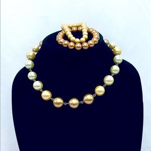 Gold tone necklace with two bracelets
